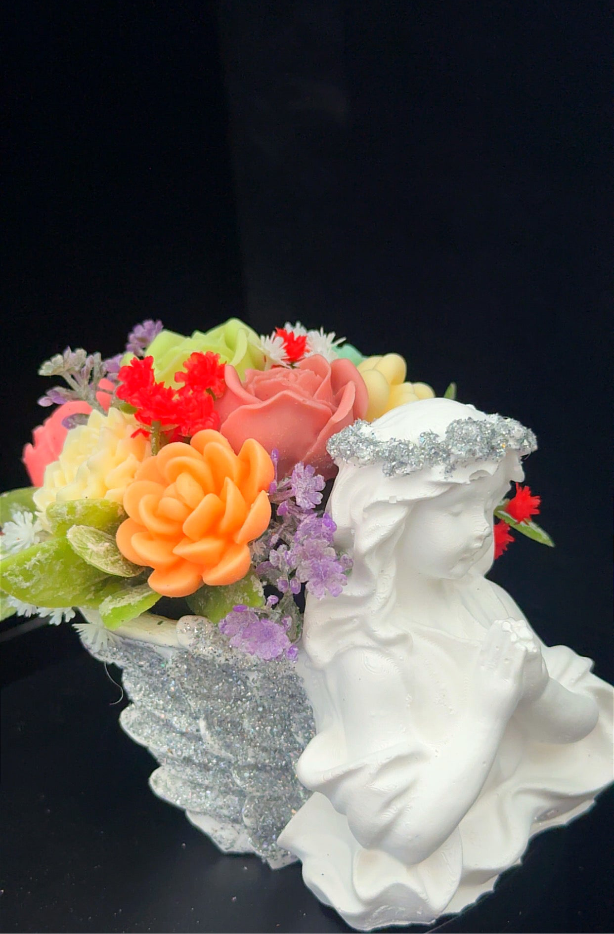 Angel statue with candle flower￼